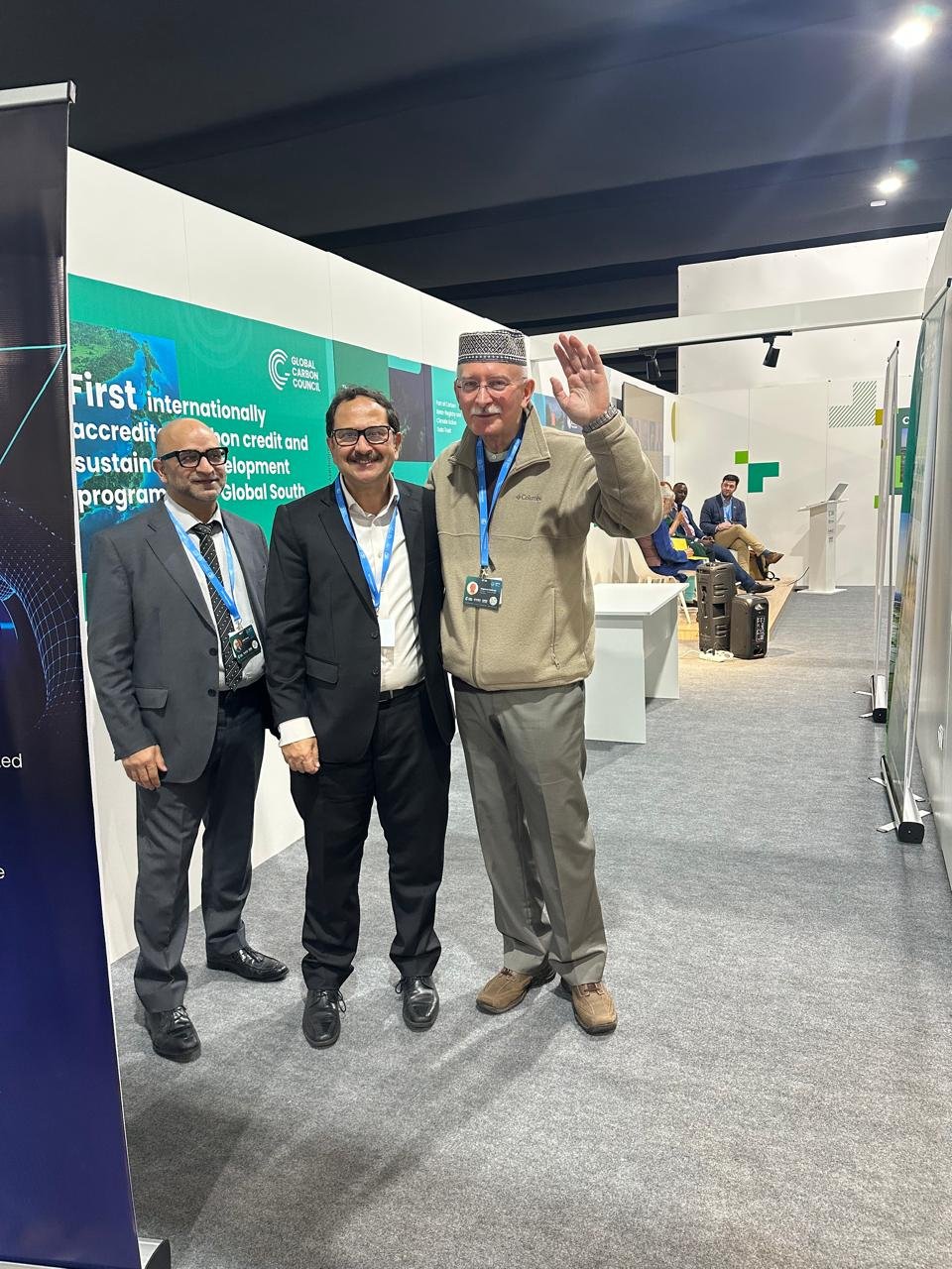 Bilal Anwar with colleagues at the Global Carbon Council booth at a conference expo