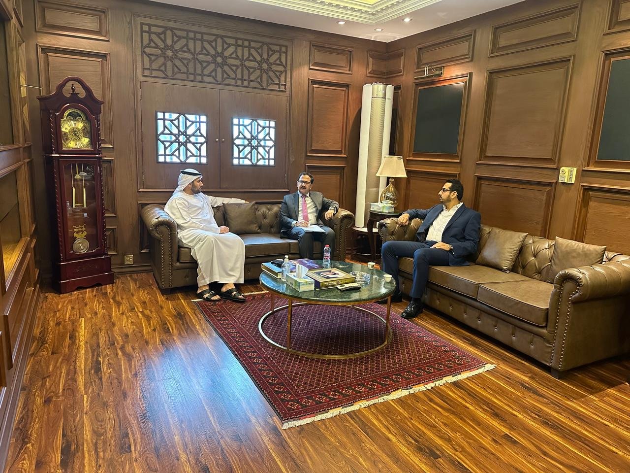 Bilal Anwar in a bilateral meeting in a wood-panelled majlis in the United Arab Emirates