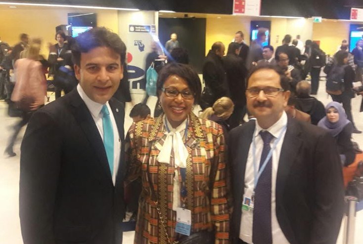 Bilal Anwar with two fellow delegates in the concourse at COP24